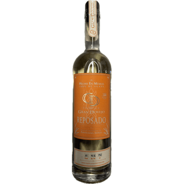 Bottle of Gran Dovejo Reposado tequila with an orange label.